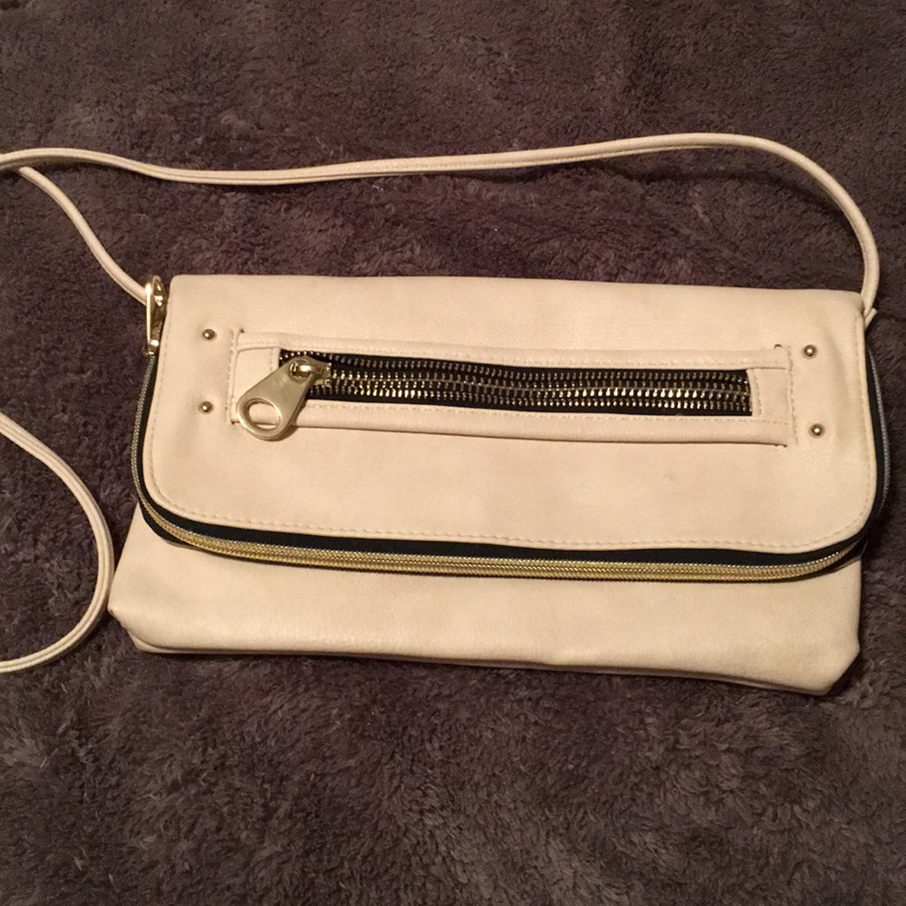 White and gold colored purse